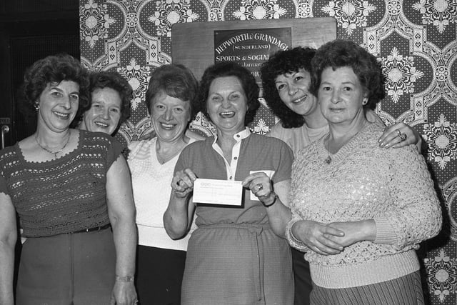 Hepworth and Grandage Sports and Social Club members with a £1,000 cheque for charity in 1980. Remember this?