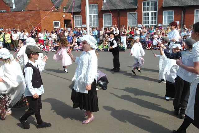 Traditional maypole dancing at Hetton Lyons Primary School in 2008. The tradition is believed to be based on a celebration of the arrival of Spring by dancing around decorated trees.
