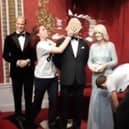 Screen grab taken from a handout video issued by Just Stop Oil of two activists throwing chocolate cake on a waxwork model of King Charles III at Madam Tussauds in London. Credit: Just Stop Oil/PA Wire