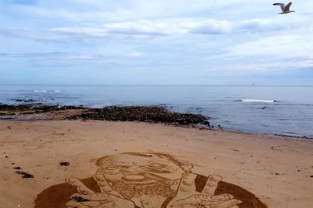 Jax Higginson's Winston Churchill artwork drawn out on the beach for VE Day's 75th anniversary on May 8.