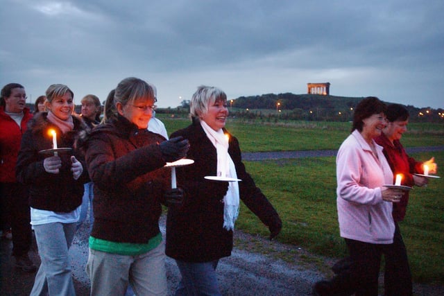 A candlelit walk raised money for the fight against cancer 17 years ago. Who do you recognise in this photo?