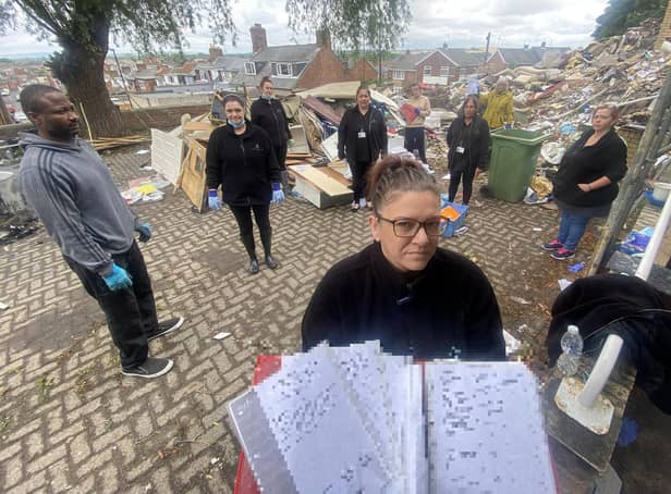Debbie Hodgkins alongside other residents and some of the discarded paperwork at the former site of The Manor House Care Home on Easington Lane. 

Picture by FRANK REID