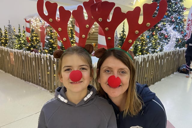 Maddie Doran with daughter Elise, dressed in antlers and red noses ahead of the race.