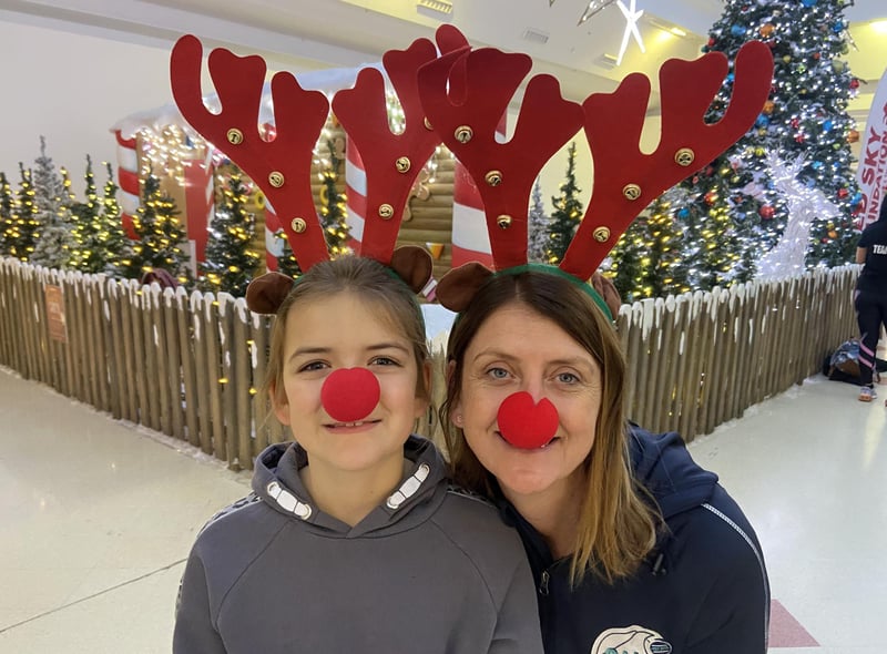 Maddie Doran with daughter Elise, dressed in antlers and red noses ahead of the race.