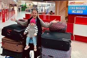 Joanna with her daughter Matylda and the suitcases full of supplies for Ukrainian refugees.