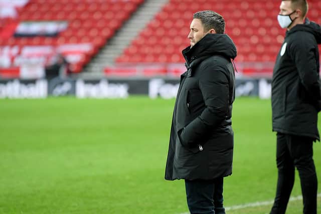 Lee Johnson watches on during his first game in charge