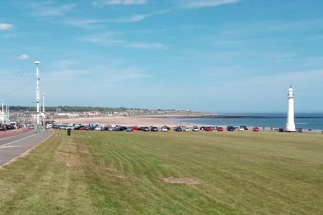 Cars parked on the grass at Seaburn