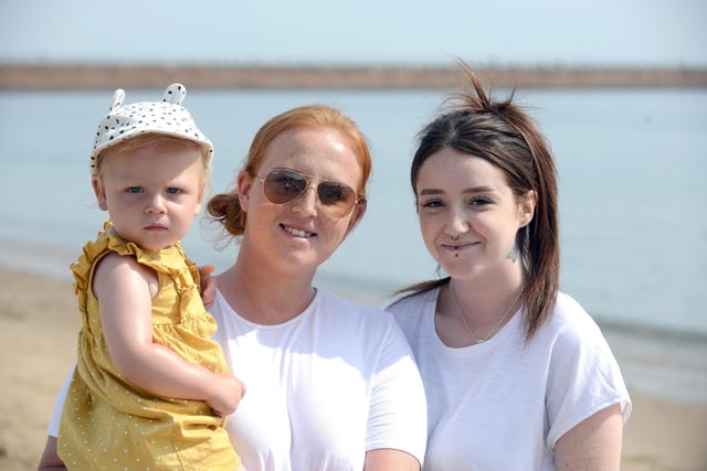 High temperatures at Roker Beach. Steph Hunter with daughter Esther Black, 1 and sister Lauren Hunter.