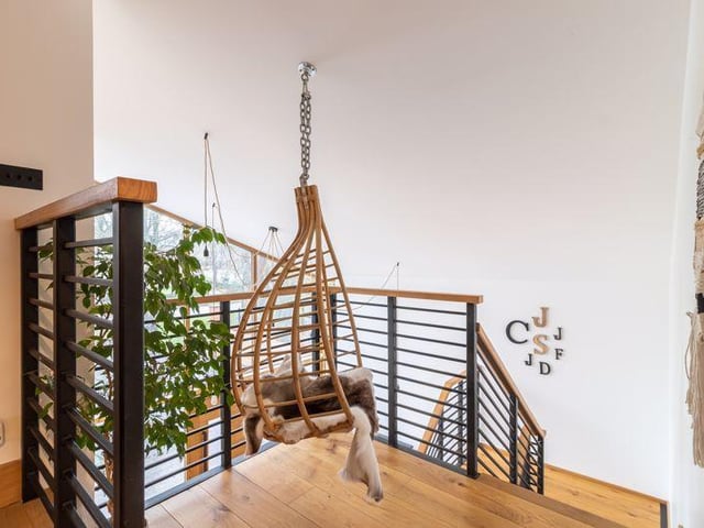 A hanging chair on the first-floor landing.