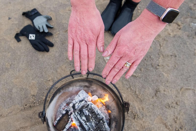 The fire pit is incredibly welcome when they come out of the water!