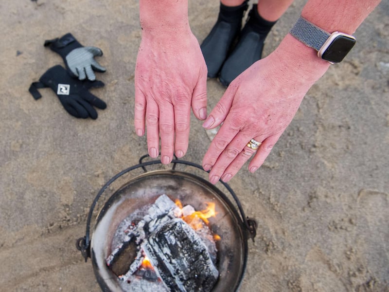 The fire pit is incredibly welcome when they come out of the water!
