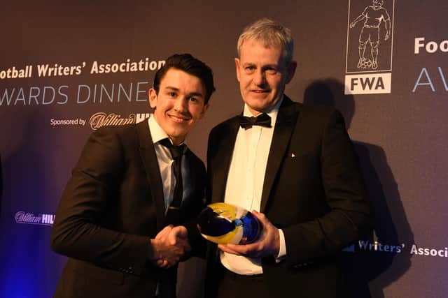 Luke O'Nien receives his award from Mark Robson. Picture by The Sir Bobby Robson Foundation.