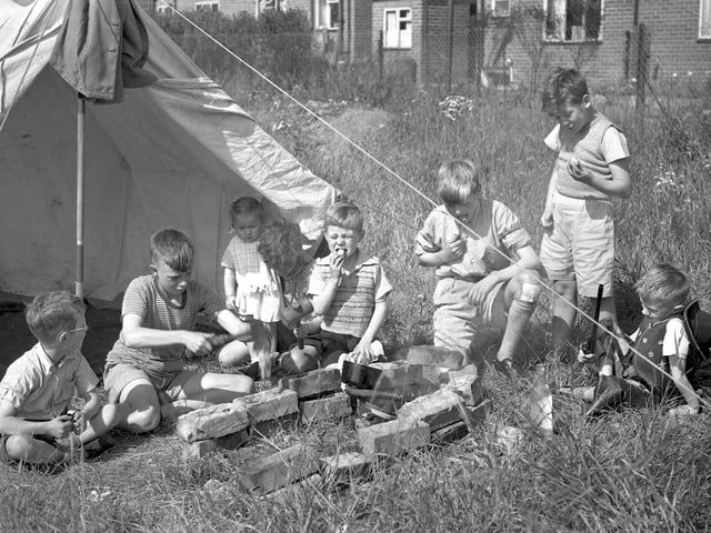 These young Wearsiders enjoy an early lunch of new potatoes at their camp near South Hylton in 1954.
