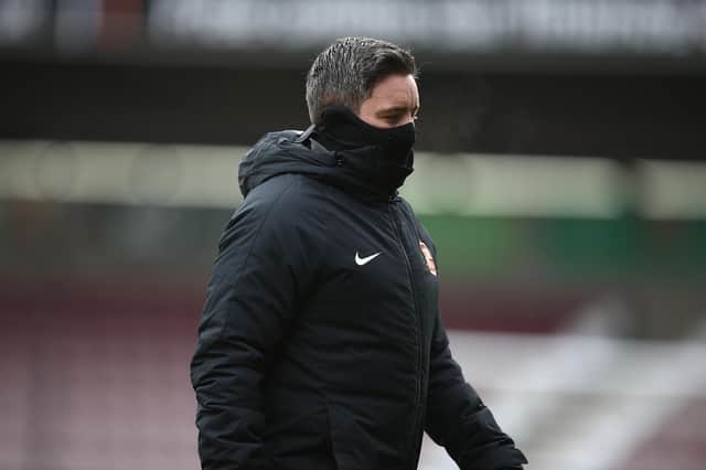 Sunderland head coach Lee Johnson walks from the pitch prior to the Sky Bet League One against Northampton Town.
