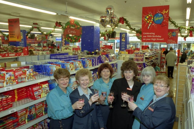 Time for a celebration in 1999 when Woolworths staff celebrated the store's 90th anniversary.