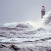Huge waves crash the against the sea wall and Roker Lighthouse in Sunderland during Storm Arwen which saw gusts of almost 100 miles per hour battering areas of the UK. Picture date: Saturday November 27, 2021.