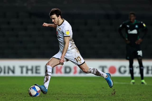 Scott Fraser of Milton Keynes Dons takes a penalty to score their second goal during the Sky Bet League One match between Milton Keynes Dons and Plymouth Argyle.