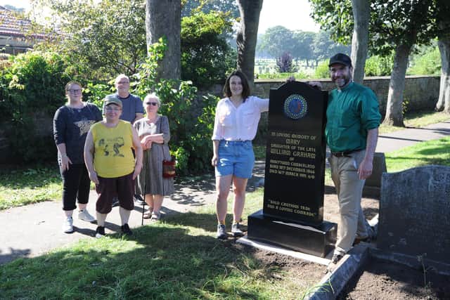 Rev Chris Howson, ceramic artist Mary Watson, with Friends of Sunderland Cemeteries, Stephanie Smith, Zoe Heslop, Allan Tutty and Jean Spence, and the restored headstone to Wearside radical acitvist "Mary" at Mere Knolls Cemetery, Sunderland.