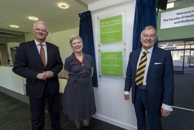 John Dawson and his wife Sam with Vice Chancellor and Chief Executive Sir David Bell (left)
