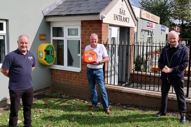 A defibrillator being installed at the Stella pub. (left to right) Ronnie Monaghan (past president), Frank Reay representing the Stella pub and former Washington West Ward councillor Bernie Scaplehorn.