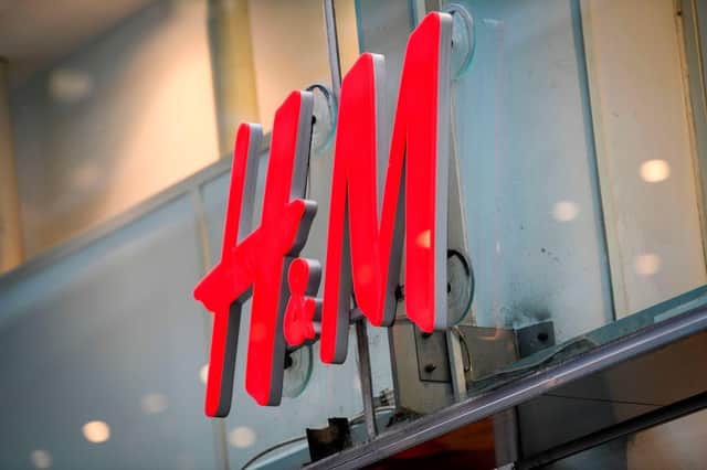 The logo of H & M (Hennes & Mauritz AB) (Photo by FREDRIK SANDBERG/TT News Agency/AFP via Getty Images)