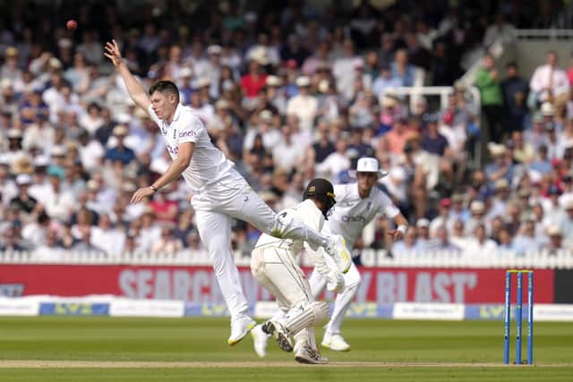 England's Matthew Potts leaps to catch a ball after bowling during the second day of the test match between England and New Zealand at Lord's cricket ground in London, Friday, June 3, 2022. (AP Photo/Kirsty Wigglesworth)
