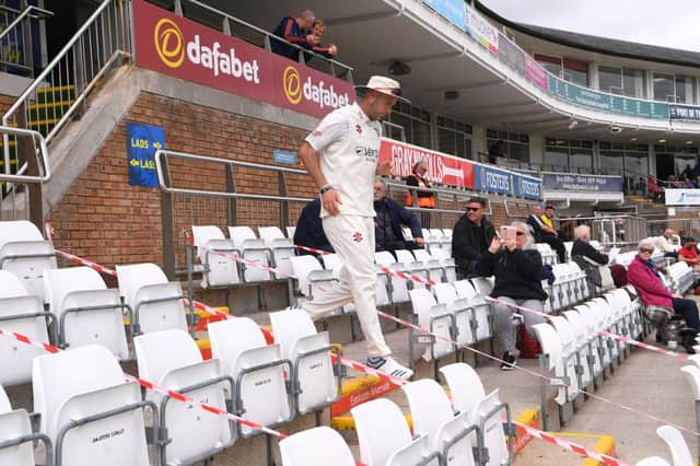 Durham bowler Chris Rushworth makes his way down the pavilion steps to the pitch past spectators for the first time at the Riverside this season before day one of the LV= Insurance County Championship match between Durham and Essex at Emirates Riverside.