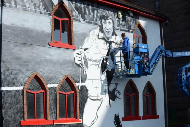Frank uses historic photos to create his murals