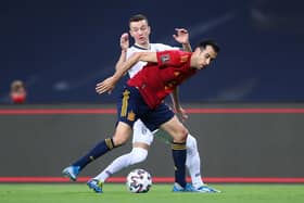 Sergio Busquets of Spain is challenged by Bersant Celina of Kosovo during the FIFA World Cup 2022 Qatar qualifying match between Spain and Kosovo at Estadio Olimpico on March 31, 2021 in Seville, Spain. (Photo by Fran Santiago/Getty Images)