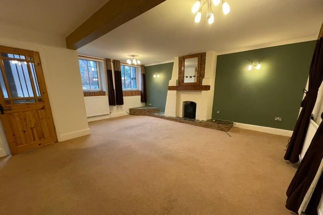 The first main room you encounter on entering the property is this bright and airy lounge, with feature fireplace and two uPVC double-glazed windows to the front. There is also a TV point, central heating radiator and a window to the back.