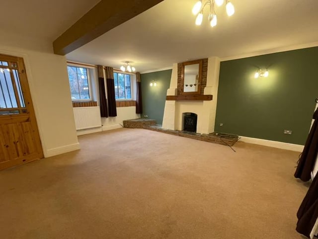 The first main room you encounter on entering the property is this bright and airy lounge, with feature fireplace and two uPVC double-glazed windows to the front. There is also a TV point, central heating radiator and a window to the back.