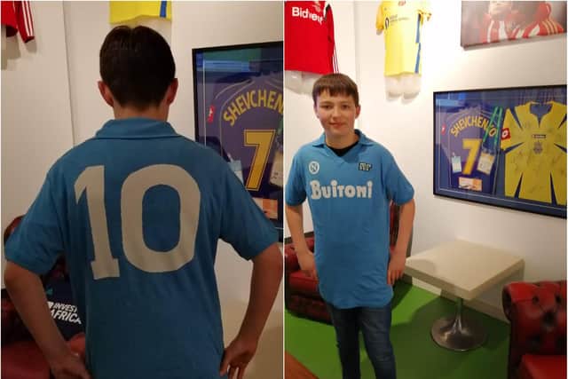 This lucky young football fan has already tried on Diego Maradona's Napoli shirt.