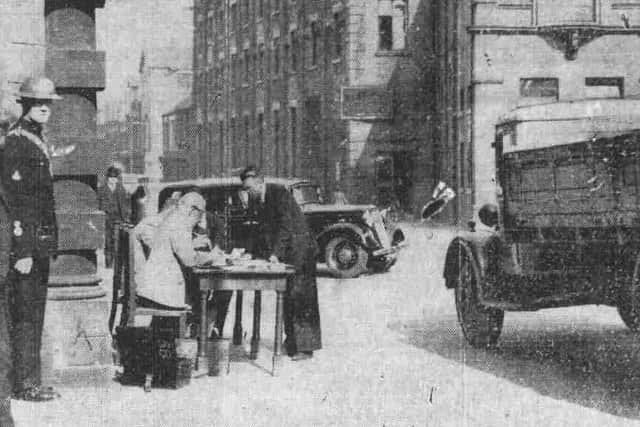 Another of the effects of war. Vehicle owners turn over their vehicles to the authorities at a Sunderland police station.