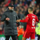 Jurgen Klopp, Manager of Liverpool embraces with Thiago Alcantara of Liverpool during the UEFA Champions League Semi Final Leg One match between Liverpool and Villarreal at Anfield on April 27, 2022 in Liverpool, England. (Photo by Catherine Ivill/Getty Images)