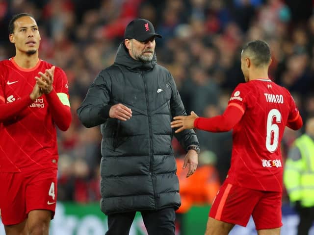 Jurgen Klopp, Manager of Liverpool embraces with Thiago Alcantara of Liverpool during the UEFA Champions League Semi Final Leg One match between Liverpool and Villarreal at Anfield on April 27, 2022 in Liverpool, England. (Photo by Catherine Ivill/Getty Images)