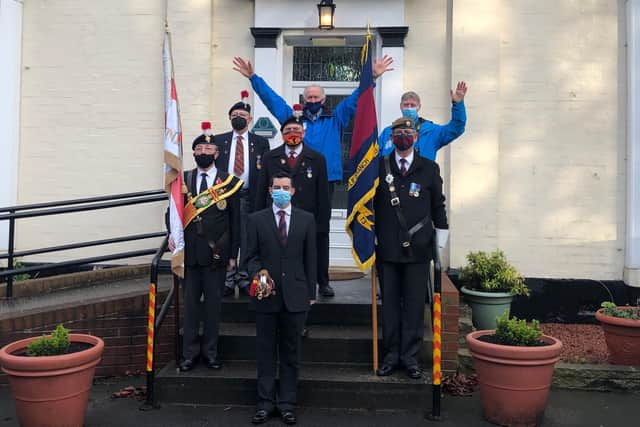 Daft as a brush founder Brian Burnie (middle back row), with Bill Hall (Northumberland Fusiliers), Bob Bulmer (Standard Bearer Sunderland Fusiliers), Bob Hardy (Coldstream Guards), Brian Hindmarsh (Bugler) and Peter Stoten (DAAB Administrator) outside the Houghton care home where Len is currently living.