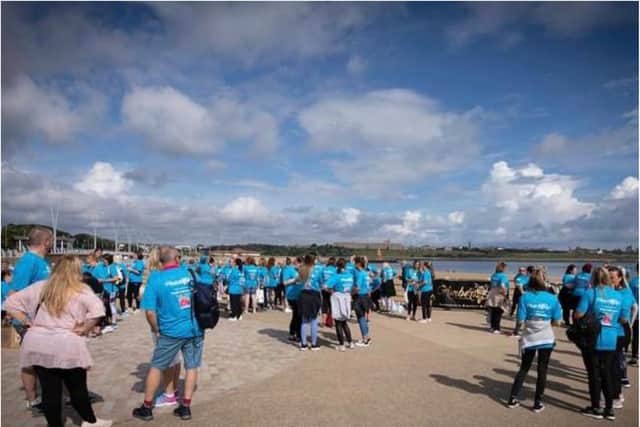 More than 100 people turned out for the walk wearing t-shirts in memory of Trisha Dalton Atkinson.