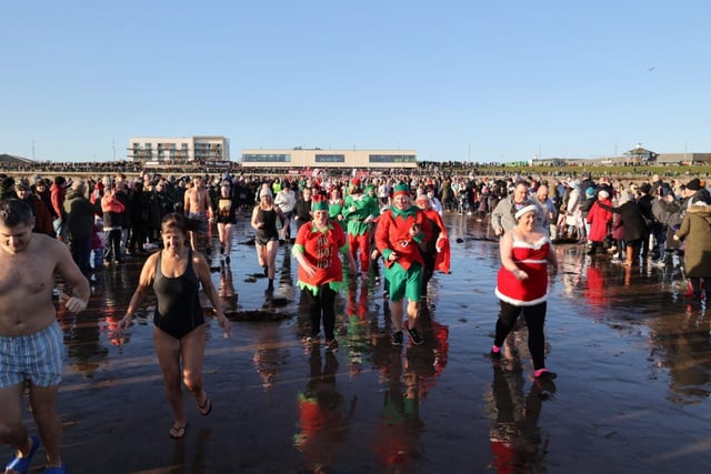 Around 350 dippers took part, while crowds lined the beach and promenade