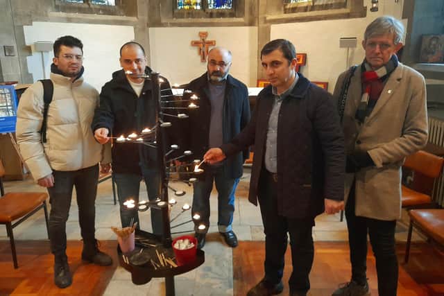 At the vigil were, from left: Ilhami Unal, Yusuf Erdogan, Enis Kaan Emecan and Captain Gungor Ayaz, local Turkish residents, with Steve Newman of Sunderland Inter Faith Forum.