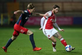 Wes Burns of Fleetwood Town battles for possession with Denver Hume of Sunderland during the Sky Bet League One match between Fleetwood Town and Sunderland at Highbury Stadium