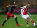 Wes Burns of Fleetwood Town battles for possession with Denver Hume of Sunderland during the Sky Bet League One match between Fleetwood Town and Sunderland at Highbury Stadium
