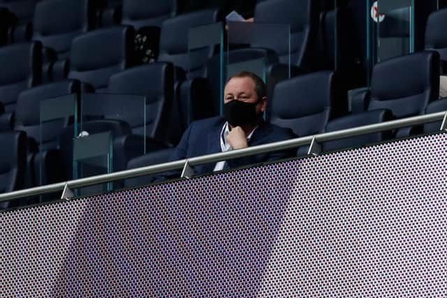 Mike Ashley watches a Newcastle United game last year.