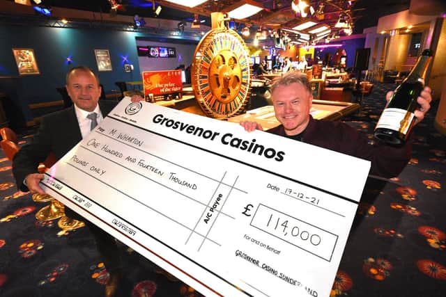 £114,000 winner Mickey Wharton (right) celebrates his life changing win with Grosvenor Casino general manager Mark Hunter.