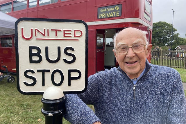 Bob Kell 86 next to a United Bus Stop sign. Vintage car and bus rally, held at Seaburn Recreational Ground.