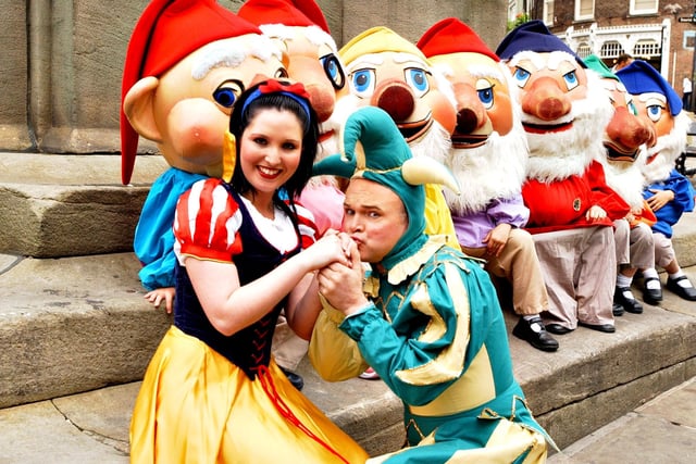 Court jester Pee Wee Price has a kiss for Snow White Anna Flowers to promote the 2004 panto at Durham's Gala Theatre.
