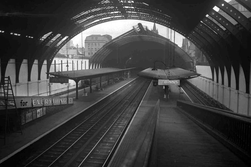 Reconstruction work on the south end of Sunderland Station was nearly completed, with neon-lit station name signs, hanging plants, and large pots of blooms in May 1953.