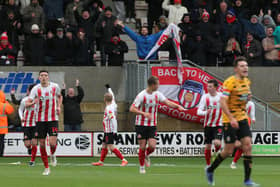 Sunderland players celebrate after Alex Pritchard's goal at Cambridge.
