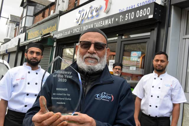 Spice 1 owner Syed Rahman with the Echo's Takeaway of the Year trophy with, from left, head chef Bablu Rahman, Ali Abdul and Zakaria Kazi.