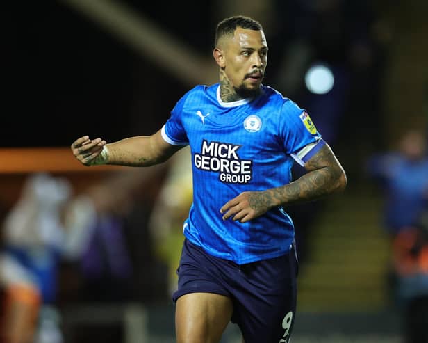 PETERBOROUGH, ENGLAND - OCTOBER 25:  Jonson Clarke-Harris of Peterborough United celebrates after scoring their third goal during the Sky Bet League One between Peterborough United and Accrington Stanley at London Road Stadium on October 25, 2022 in Peterborough, England. (Photo by David Rogers/Getty Images)