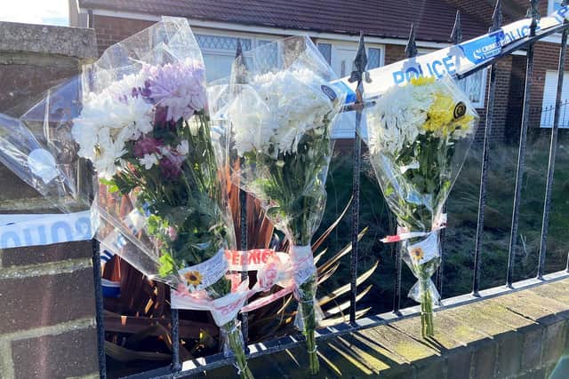 Flowers left at the scene of the fire at Tunstall Village Green.